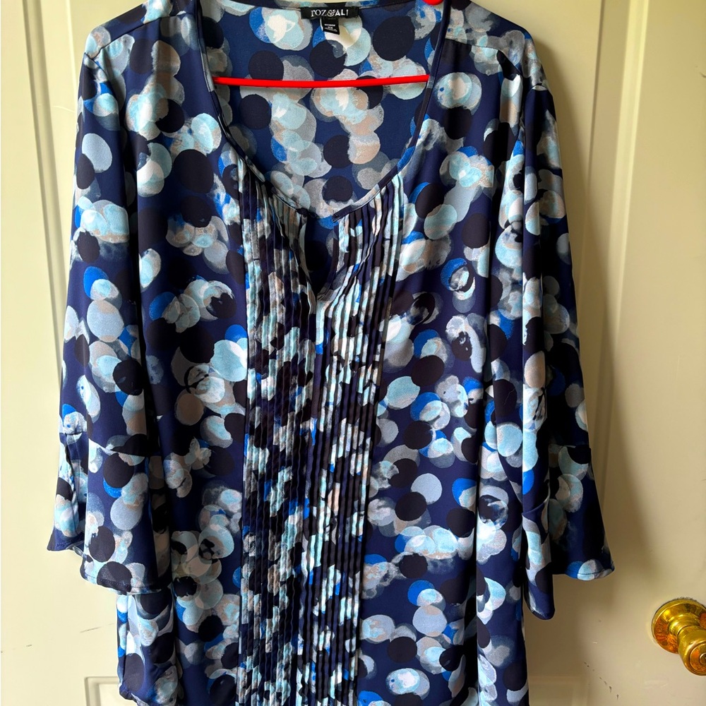 Dressy tunic top with pleat details in blue